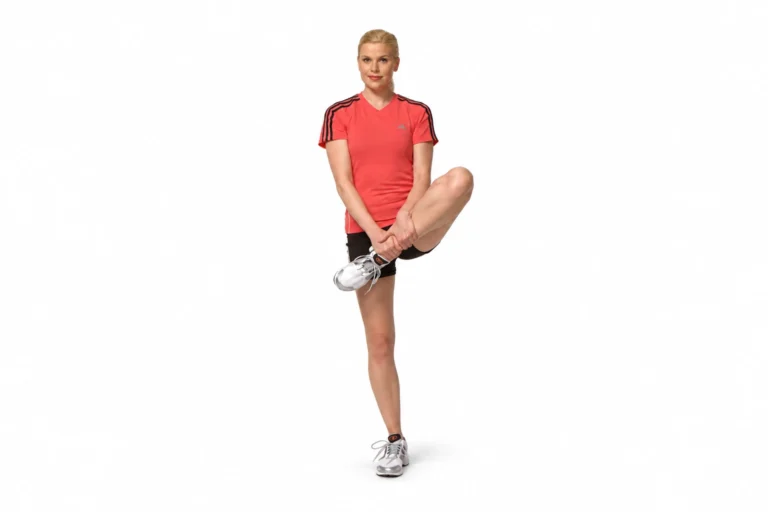 Standing piriformis stretch with the raised lower leg supported by both hands