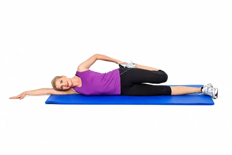 Side-Lying Quad: Top heel drawn toward the buttock while the lower leg stays straight.