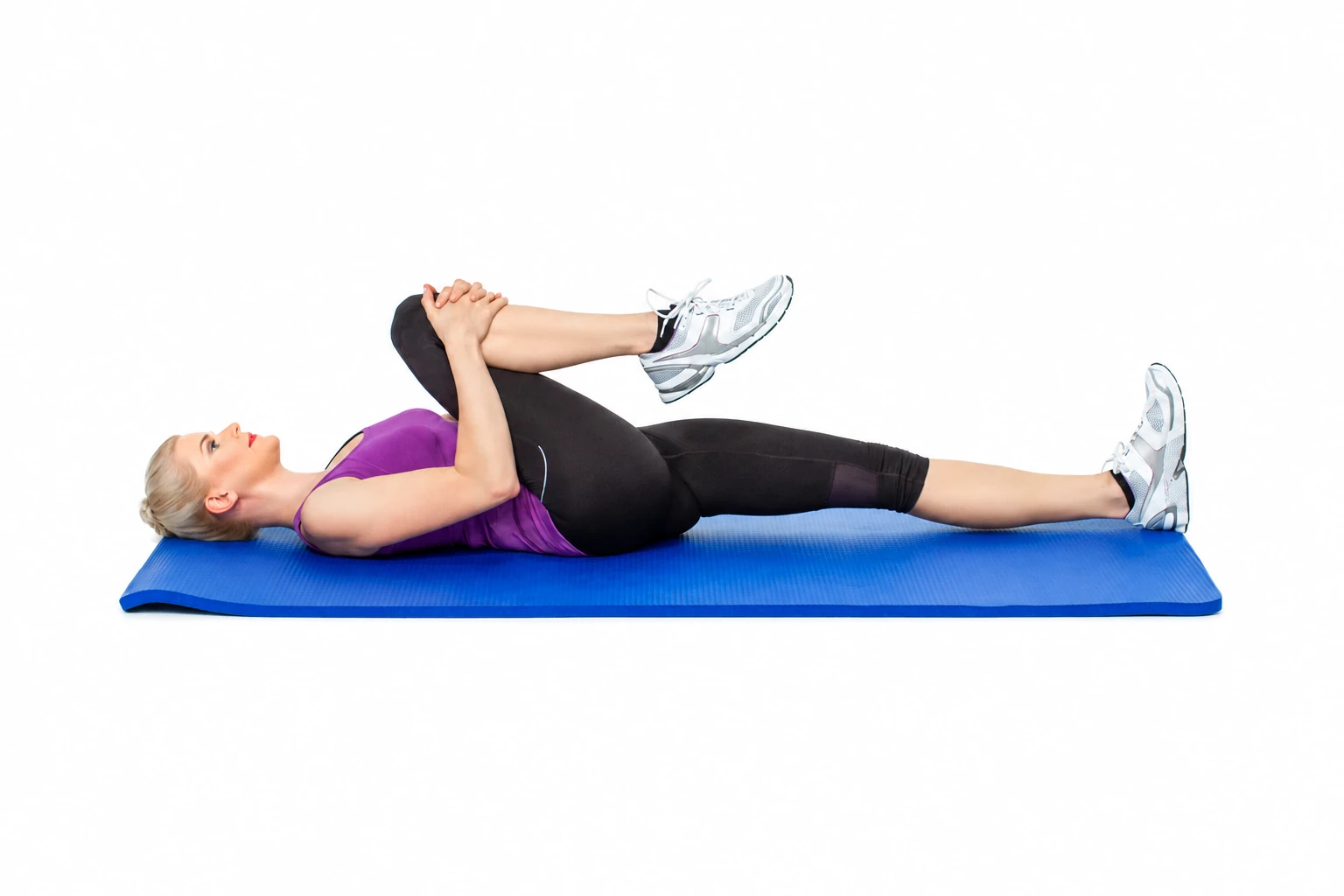 Supine Knee To Chest: One knee drawn toward the chest while the other leg remains extended.