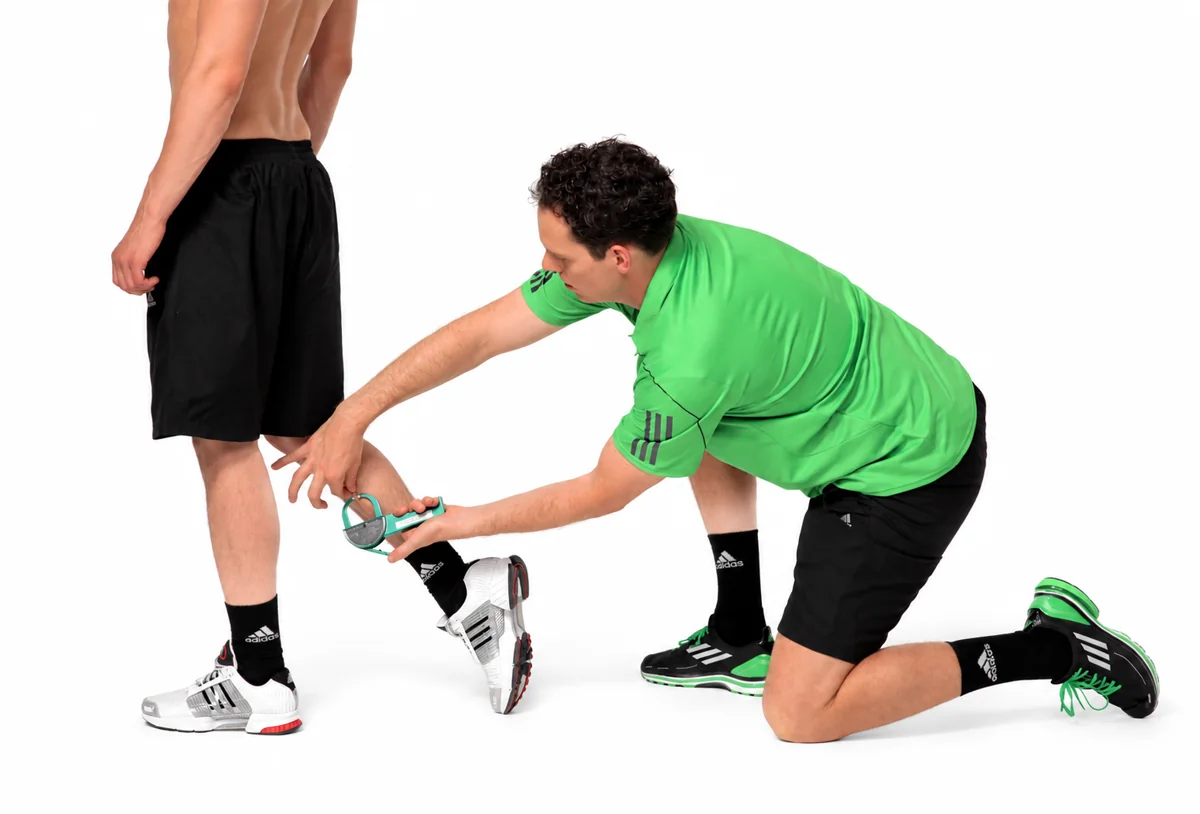Caliper at an adult model’s calf; regional reference without a verified youth landmark.