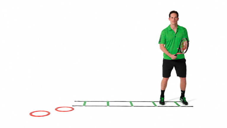 Racquet ready position beside the two-ring step-in area.