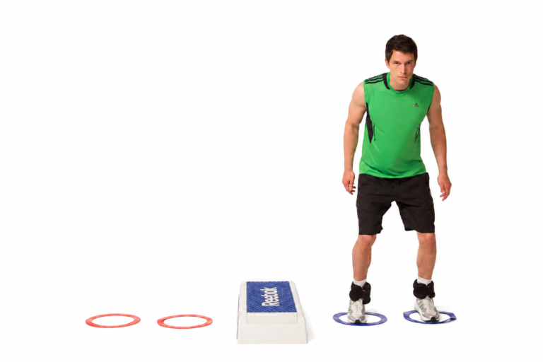 Setup reference: ankle weights, a low box and two rings on each side.